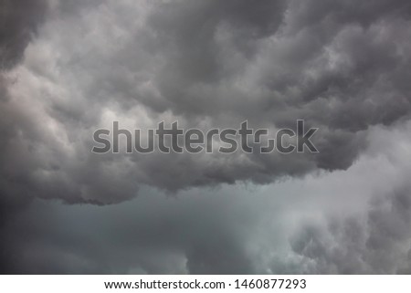Background from moody sky and dark black storm clouds. surface texture thunderstorm sky