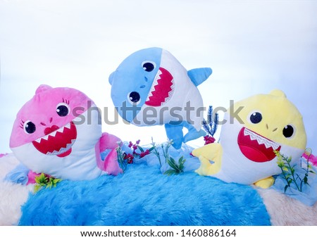 Triple baby shark play together with happiness, and cheerful