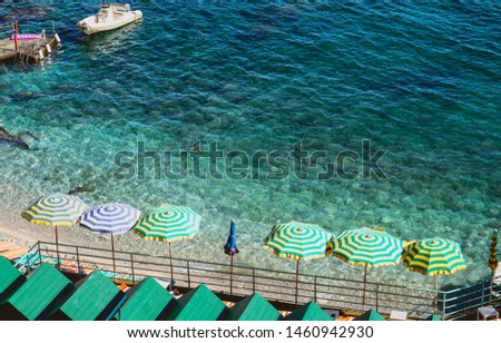 Umbrellas on the beach. Island of Capri in Italy Royalty-Free Stock Photo #1460942930