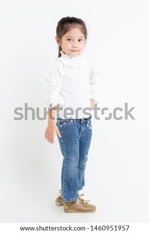 Portrait image of Lovely little Asian girl standing on white background