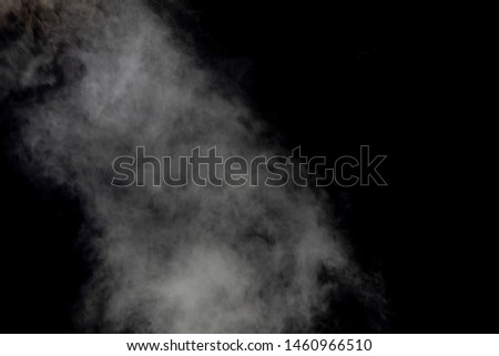 smoke blowing isolated on dark background