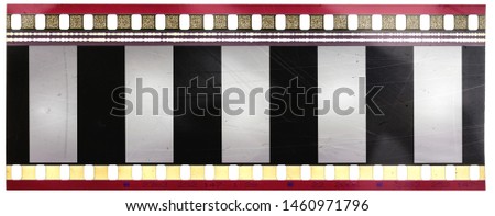 high res scan of real scratched 35mm movie cine film strip with empty frames on white background, your photos here, just blend them in via blend mode and masks Royalty-Free Stock Photo #1460971796