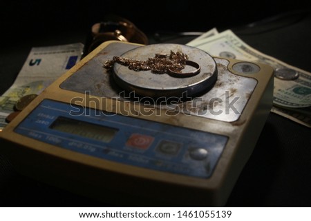 valuables and money on a black background