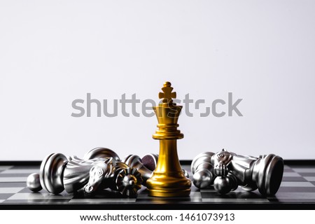 A chess king last stand as a true winner.Money game concept. Copy space. Royalty-Free Stock Photo #1461073913