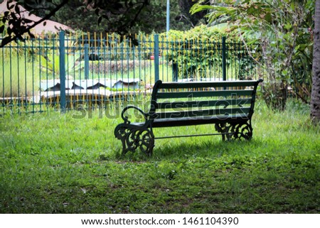 Stock photos, pictures and royalty-free images of empty dark bench in the green park in a peace and silent environment