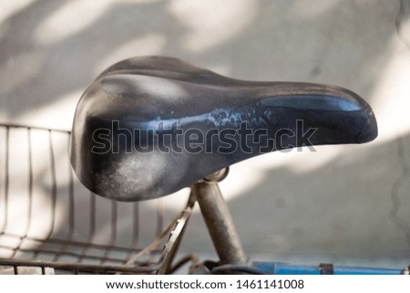old bicycle seat on black background
