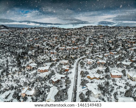 Aerial view of a snowy neighborhood