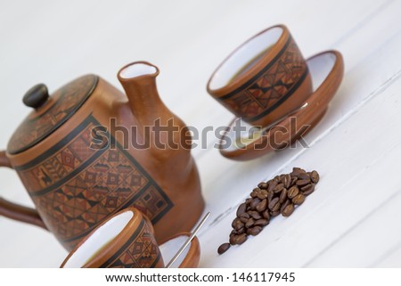 Coffee Set over a white table. Space fot your sample text.