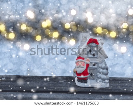 winter christmas background with santa on red car decor snow on blue wooden texture                              
