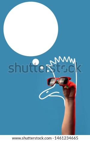 cartoon ostrich with a Mohawk in fashionable sunglasses on a blue background
