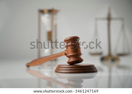 Justice concept. Law symbols isolated on gray background.