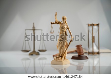 Justice concept. Law symbols isolated on gray background.