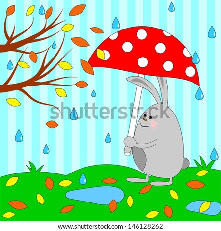 Cute rabbit under umbrella