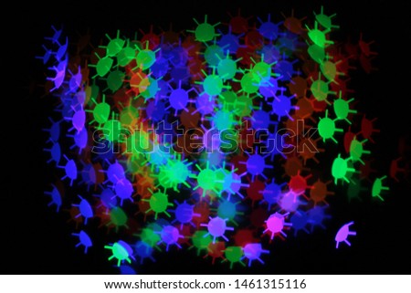 Abstract background of bright multicolor circle with spikes or sun bokeh lights saturated colors design