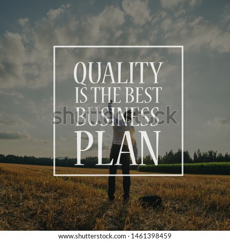 Quality is the best business plan sign over a businessman standing in nature.
