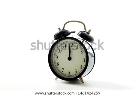 Black alarm clock retro style on white background. concept watch for text message or art work design. pointer in 12 o'clock. Royalty-Free Stock Photo #1461424259