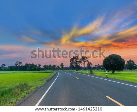 Soft focus silhouette the sunrise with the road, the beautiful sky and cloud in the morning in Thailand.