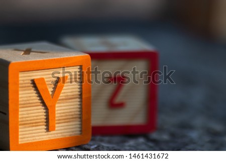 Wooden blocks for learning the english alphabet and numbers.