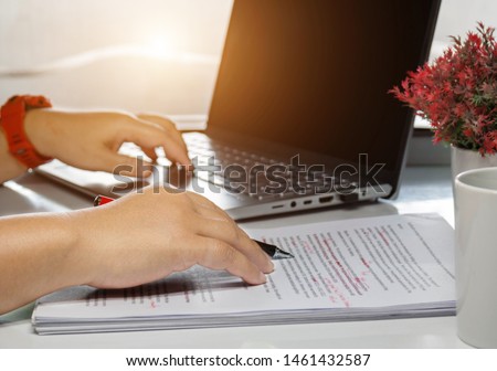 proofreading paper on table in office for service Royalty-Free Stock Photo #1461432587