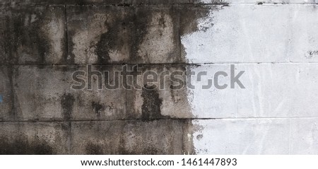 The old cement surface is damaged, peeled, modified by painting over to look new, useful and beautiful Royalty-Free Stock Photo #1461447893