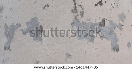 The old cement surface is damaged, peeled, modified by painting over to look new, useful and beautiful Royalty-Free Stock Photo #1461447905