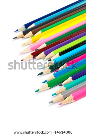 Assortment of coloured pencils with shadow on white background. Shallow depth of field