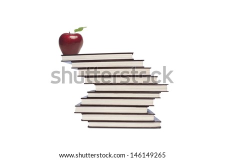 Picture of full shot of apple on top of stack of books