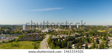 Aerial panoramic view of a residential neighborhood near Guildford Centre Mall during a sunny morning. Taken in Surrey, Vancouver, BC, Canada. Royalty-Free Stock Photo #1461554105