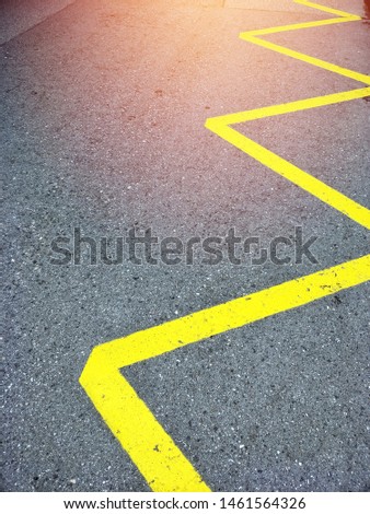 street road with yellow zigzag paint line symbol