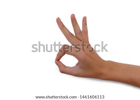 female hand makes ok sign isolated on white background