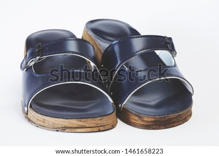 Female blue orthopedic slippers isolated over white background