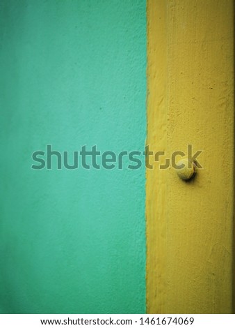 yellow and green painted textured walls contrasting colours and patterns