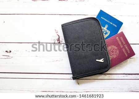Official Cuban and Italian passport with wallet Royalty-Free Stock Photo #1461681923