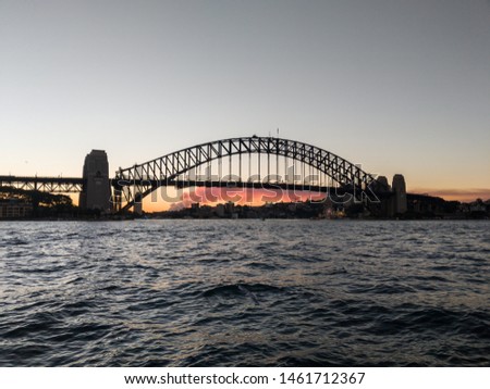 Silhouetted view of Sydney Harbour Bridge at sunset, Australia