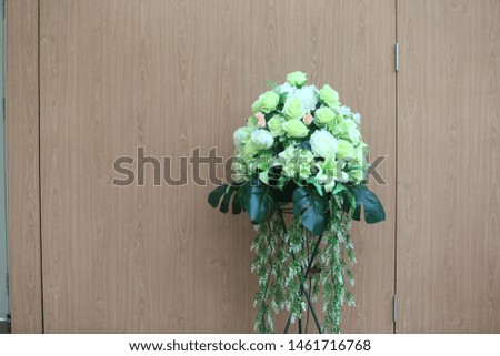 The flowers has been decorated on the white table for the event, weeding ceremony, meeting concept.
