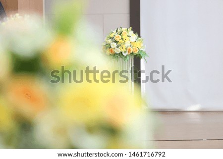 The flowers has been decorated on the white table for the event, weeding ceremony, meeting concept.