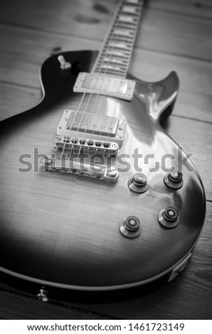 
black and white photo of a guitar