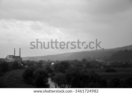 Foggy morning in an old communist town. Black and white photography.  Misty dreamy landscape. 
