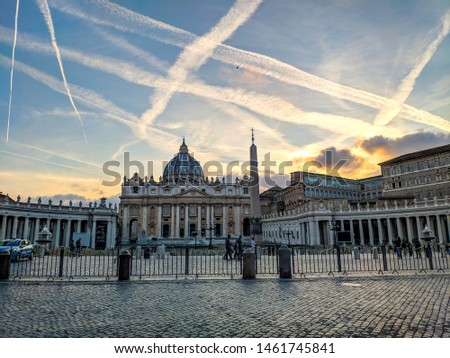 Incredible sky in Vatican, Italy. Basilica of St. Peter. Saint Paul's Cathedral. Photos for calendars, magnets and cards. Beautiful pictures of the Vatican. Traces of airplanes in the sky.