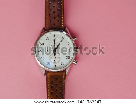  men's wrist watch on a pink background