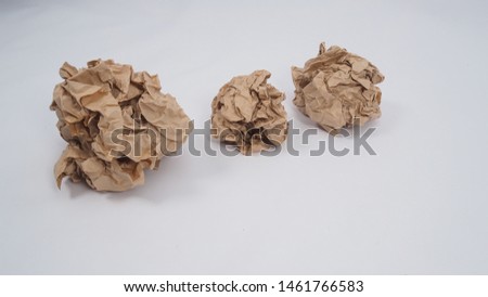 Crumpled brown paper.It is mauled on white background.