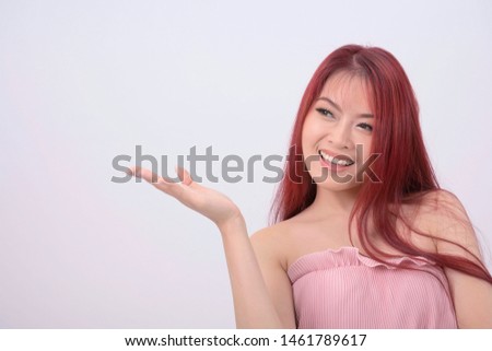 Asian happy young Woman show hand in the air on isolated white background