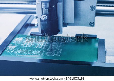 Automated manufacturing process for boards or microchips for electronics or computers.