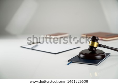 Law business.Lawyers office. Gavel on white table. Bokeh background.