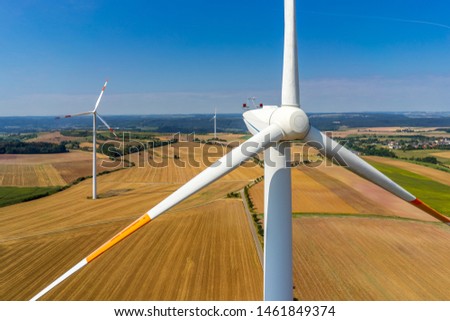wind turbine in a field aerial picture close up