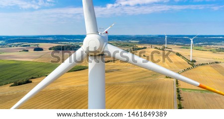 wind turbine in a field aerial picture close up