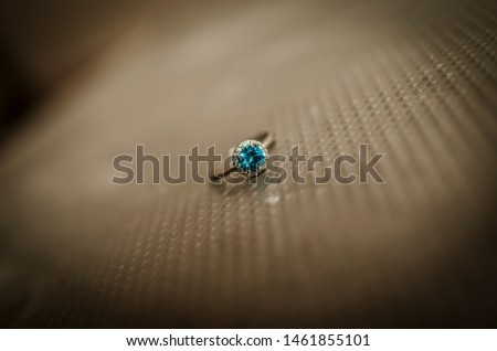 
photo of an engagement ring on metal