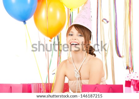 picture of happy girl with color balloons and gift bags
