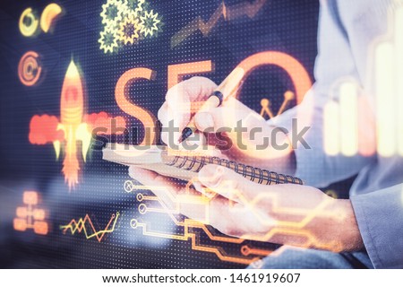 Man writing. With double exposure seo drawings.
