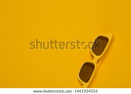 Pair of yellow cinema goggles for 3d movie theater